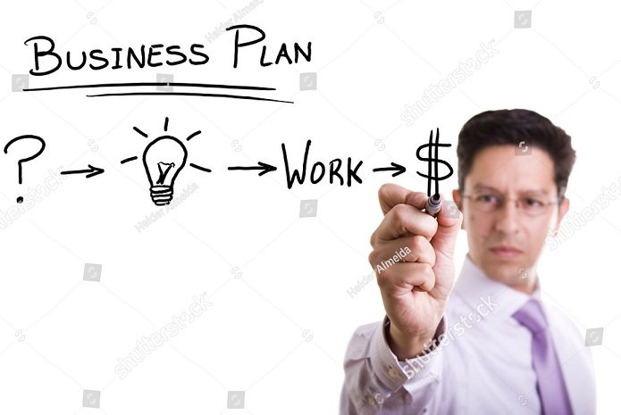 stock-photo-businessman-with-a-strategy-plan-to-be-successful-in-his-business-55989064.jpg