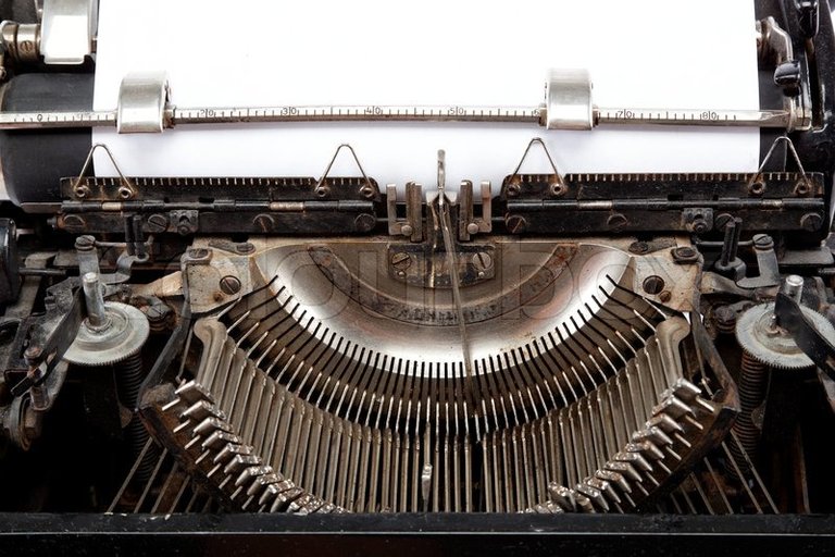 5250573-old-typewriter-with-a-sheet-of-paper.jpg