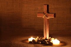 wooden-cross-candlelight-shabby-background-37618938.jpg