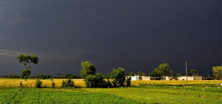 A-village-mosque-and-over-head-clouds-photos-of-Pakistani-villages.jpg