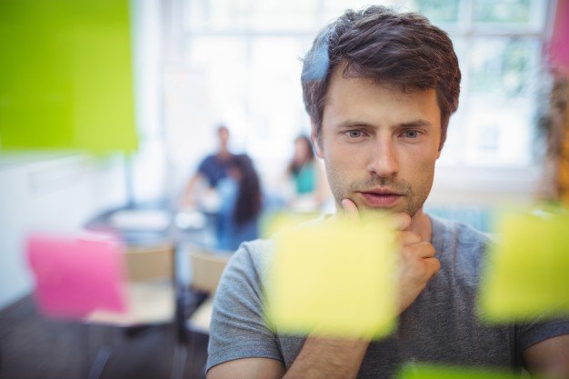 close-up-of-male-executive-reading-sticky-notes_1170-1927.jpg