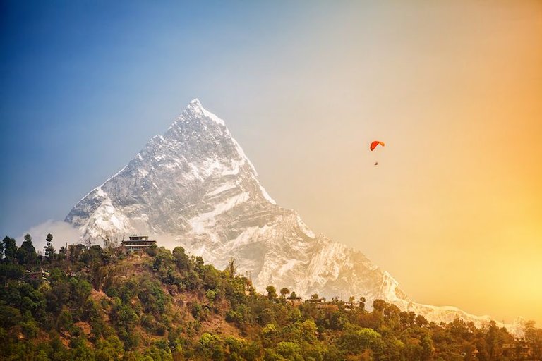 bigstock-Paragliding-In-Himalaya-72891067.jpg