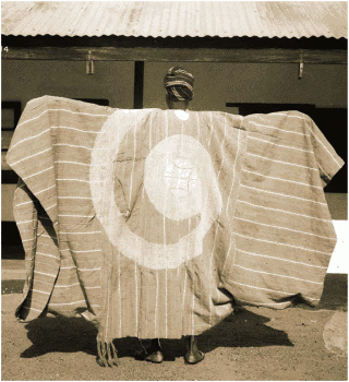 woven-yoruba-cloth-sewed-to-agbada-with-large-embroidery.png