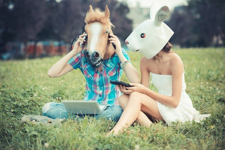 graphicstock-mask-horse-and-rabbit-women-sisters-friends-using-smartphone-and-tablet-in-the-park_BpZ6PayokZ_tn.jpg