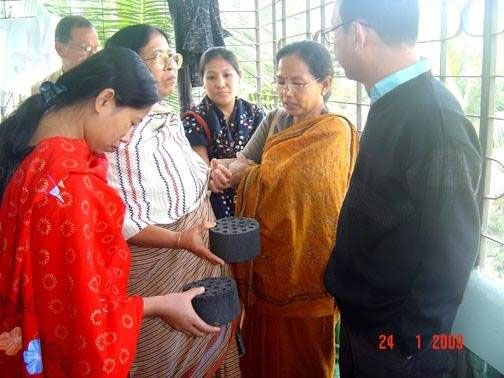 Examining bio-briquette.jpg