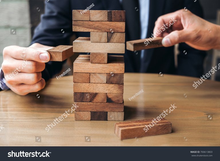 stock-photo-alternative-risk-concept-plan-and-strategy-in-business-young-intelligent-businessman-playing-the-700613803.jpg