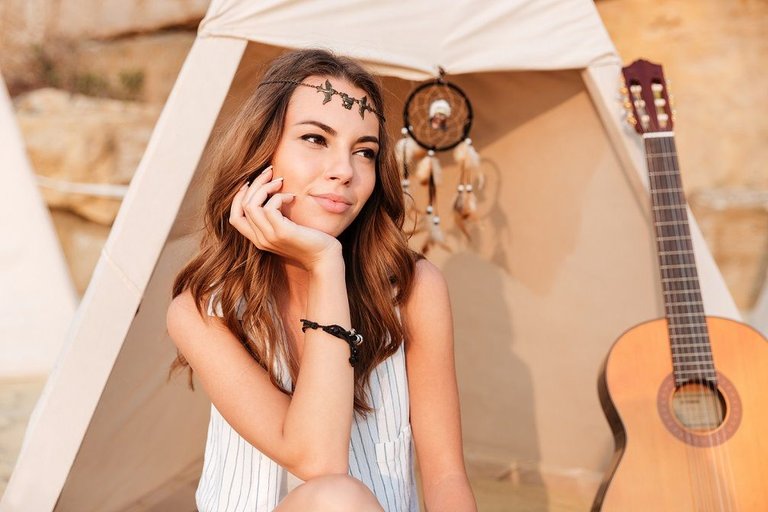 graphicstock-smiling-beautiful-hippy-girl-resting-at-the-beach-tent-at-campsite_rOKkYKHnl.jpg