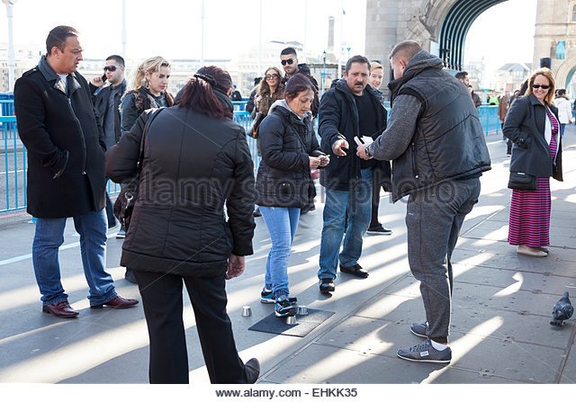 street-gambling-in-london-shell-game-also-known-as-thimblerig-performed-ehkk35.jpg