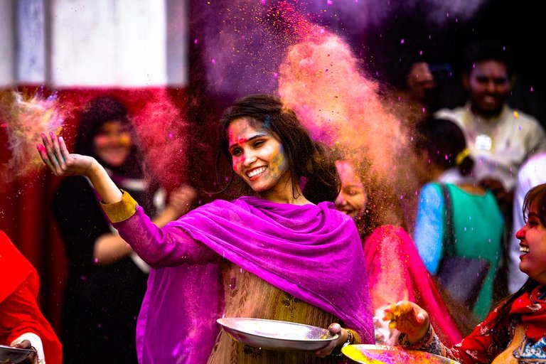 Woman tossing color powder.jpg