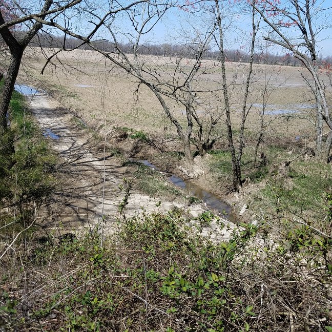 Northern view from on top of the rail overpass with ditch