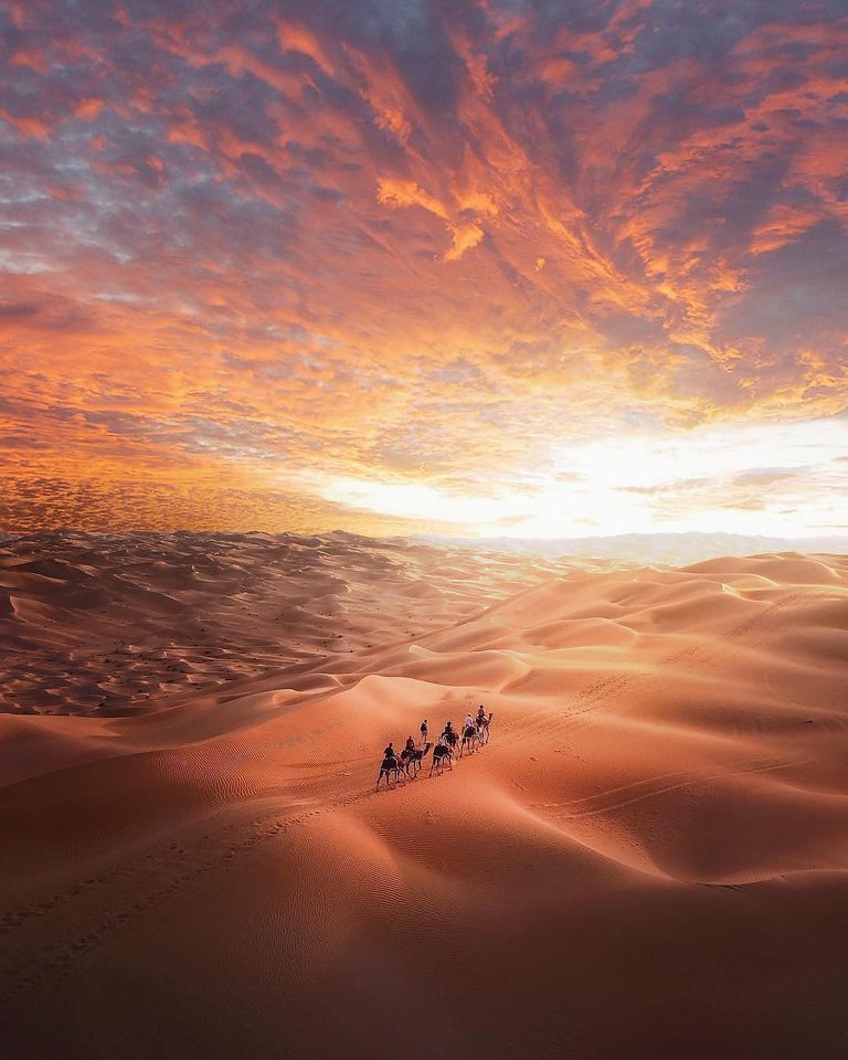 Riding through the desert as the sun goes down - AbuDhabi.jpg