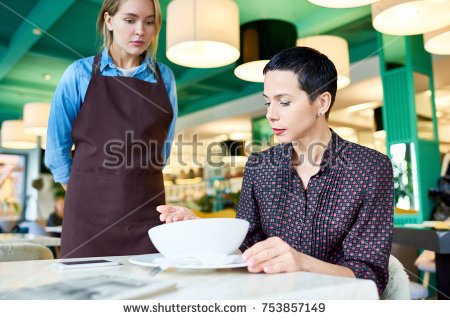 stock-photo-portrait-of-elegant-woman-complaining-about-food-quality-and-taste-to-young-waitress-in-cafe-753857149.jpg