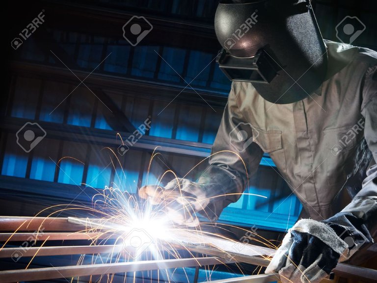 6073359-man-welding-in-workshop-with-safety-precaution.jpg