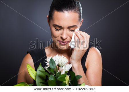 stock-photo-sad-crying-woman-at-funeral-132209393.jpg