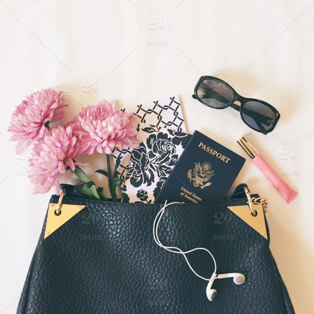 stock-photo-purse-headphones-flowers-notebook-passport-christian-siriano-0fb8f059-fc82-4314-b321-60215bd7561a.jpg