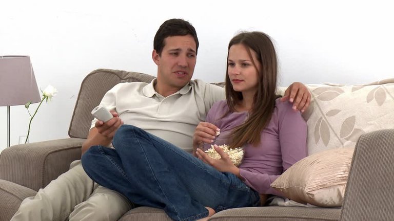 800957655-remote-control-device-popcorn-watching-tv-married-couple.jpg