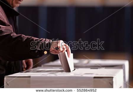 stock-photo-hand-of-a-person-casting-a-vote-into-the-ballot-box-during-elections-552864952.jpg