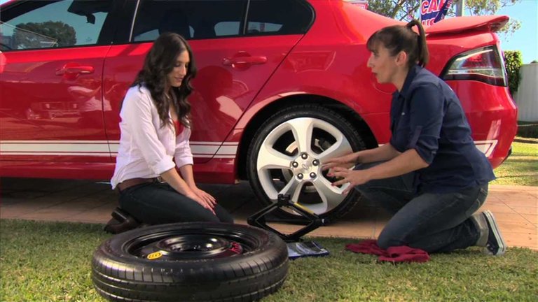 women tire change.jpg