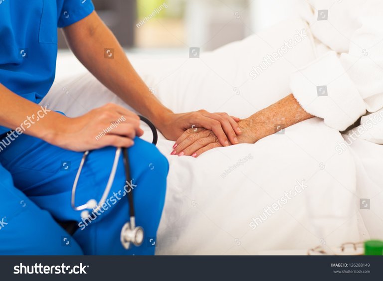 stock-photo-medical-doctor-holing-senior-patient-s-hands-and-comforting-her.jpg