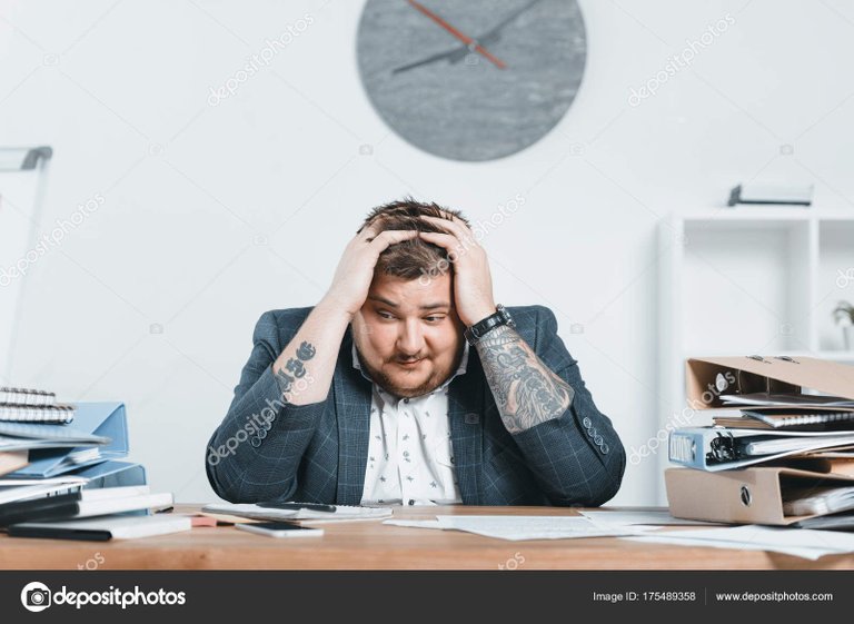 depositphotos_175489358-stock-photo-stressed-overweight-businessman-suit-working.jpg