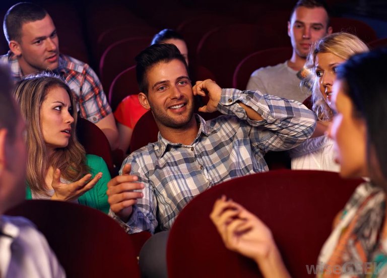 man-talking-on-phone-in-theater.jpg