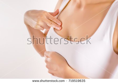 stock-photo-woman-wearing-a-white-tank-top-checking-her-breast-breast-self-exam-bse-how-do-i-check-breast-719519635.jpg