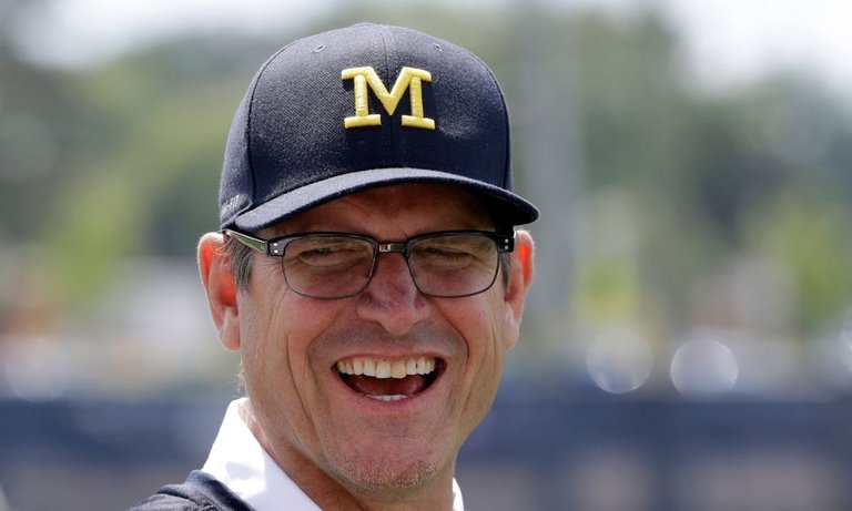 ap_michigan_harbaugh_football.jpg