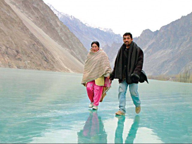Couple-walk-on-frozen-lake-Gojal-vallery-Photo-Pamir-Times-640x480.jpg