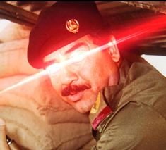 saddam hussein laser eyes.jpg