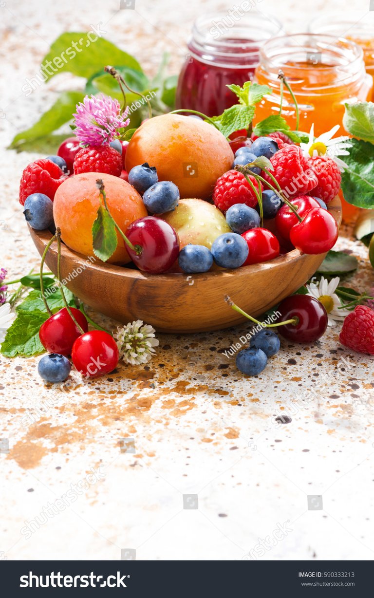 stock-photo-assortment-of-seasonal-fruits-and-berries-jams-vertical-closeup-590333213.jpg