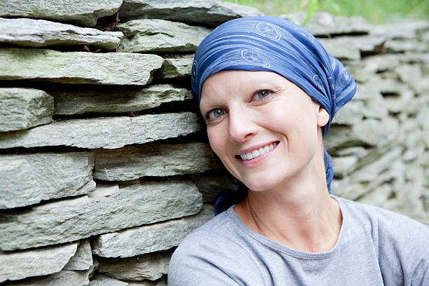 smiling-woman-with-cancer-picture-id155440751.jpg