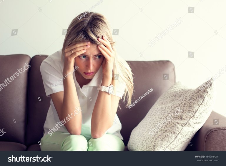 stock-photo-young-woman-in-depression-186208424.jpg