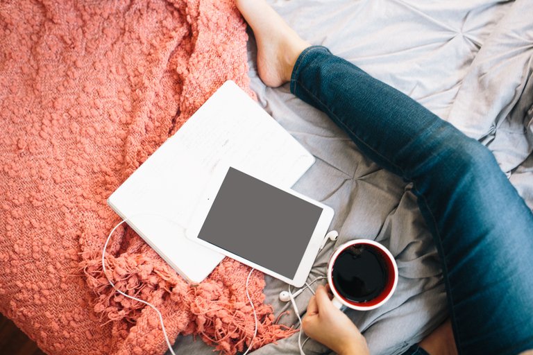 woman with tablet on bed.jpg