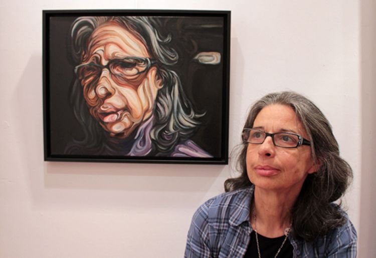 Kakia next to her portrait.jpg