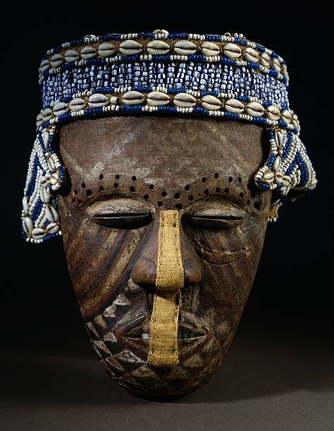 wooden-mask-with-headdress-of-pearls-and-shells-kuba-people-republic-picture-id549582353.jpg