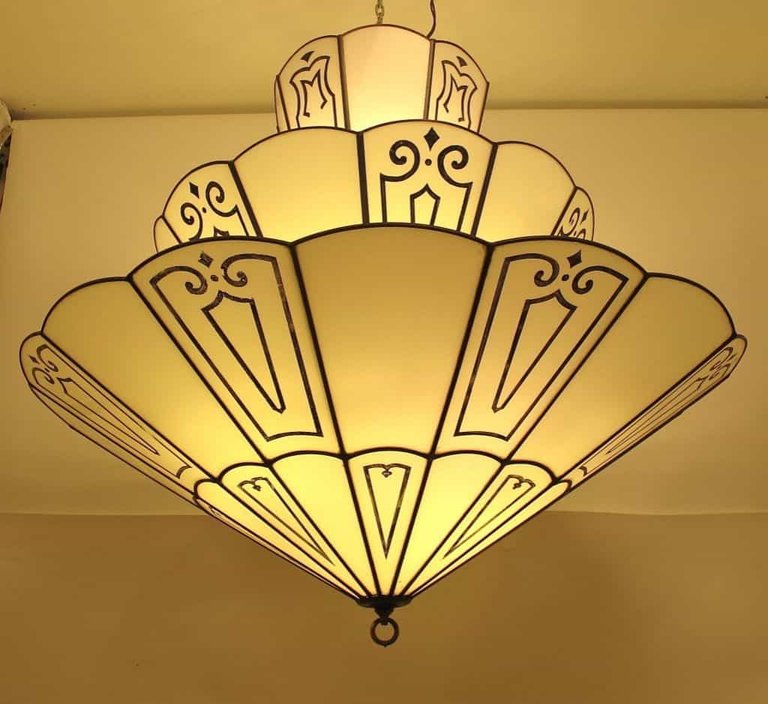 unique-tiered-art-deco-lighting-hung-in-the-ceiling-with-patterns.jpg