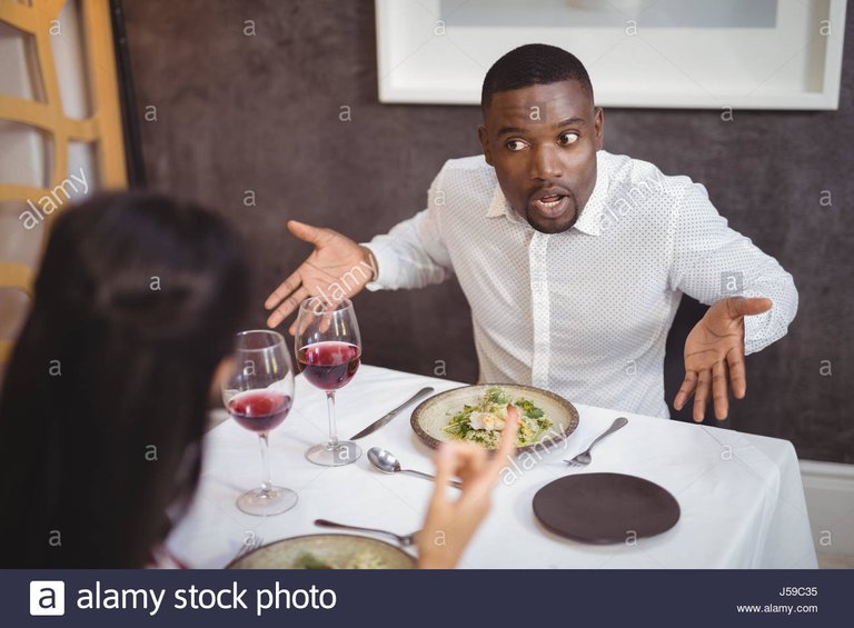 couple-arguing-with-each-other-in-restaurant-J59C35.jpg