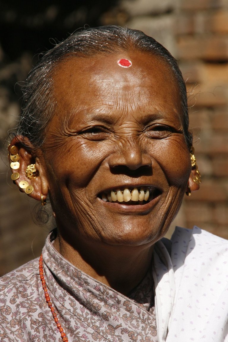 1200px-Nepali_Woman_Smiles.jpg