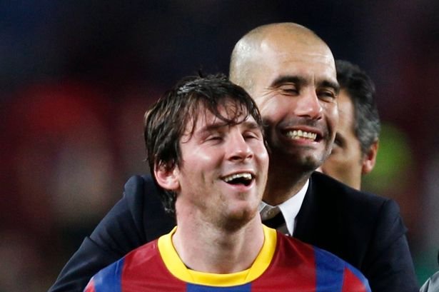 Barcelonas-coach-Guardiola-celebrates-with-Messi-after-qualifying-for-the-final-at-the-end-of-their.jpg
