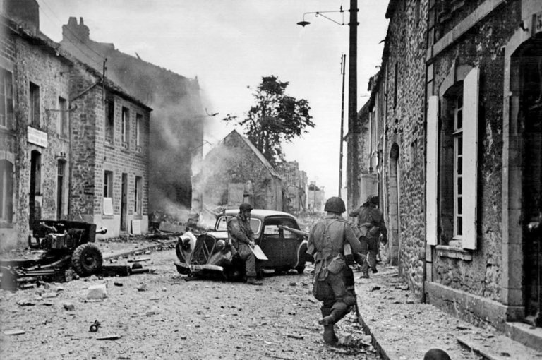 Robert Capa - Soldiers of the U.S. 82nd Airborne Division. Saint-Sauveur-le-Vicomte, France, June 16, 1944.jpg
