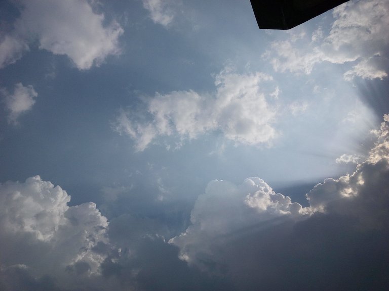 Sun rays making way out of clouds