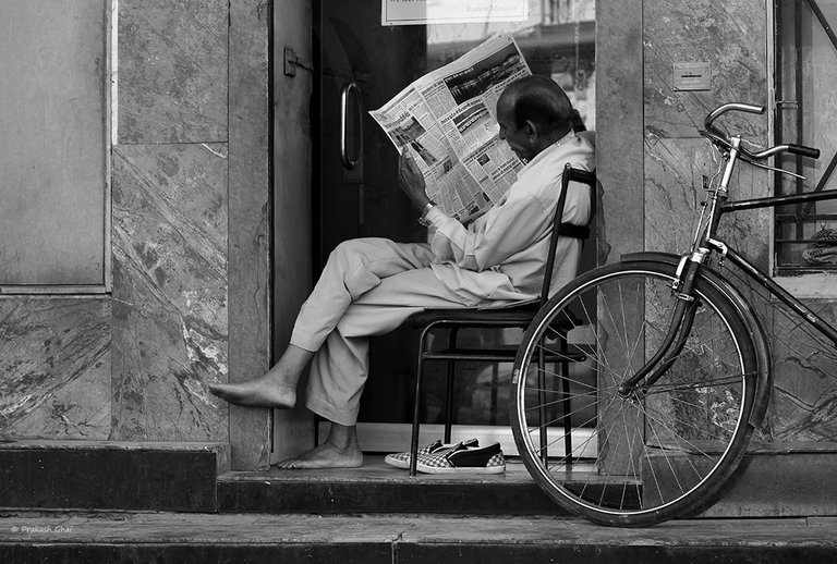 Old Man Reading News Paper Edit.jpg