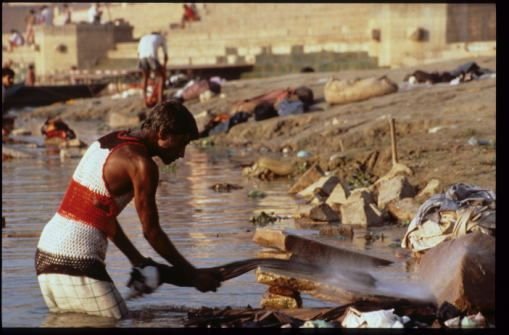 India - Varanasi - Dhobi Man at work in the Ganges.jpg