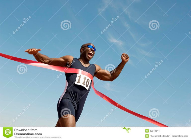 male-runner-winning-race-low-angle-view-african-american-against-blue-sky-30843844.jpg