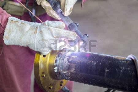 24196770-hands-welding-a-metal-pipe.jpg