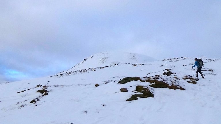 35 Nicky heading up to first false summit.jpg