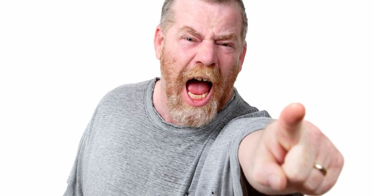 Angry-man-shouting-and-pointing-to-camera-studio-shot.jpg