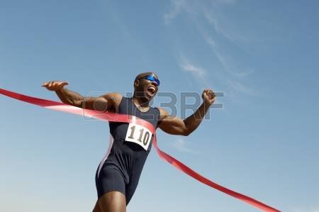 18779264-runner-breaking-finish-line-tape.jpg