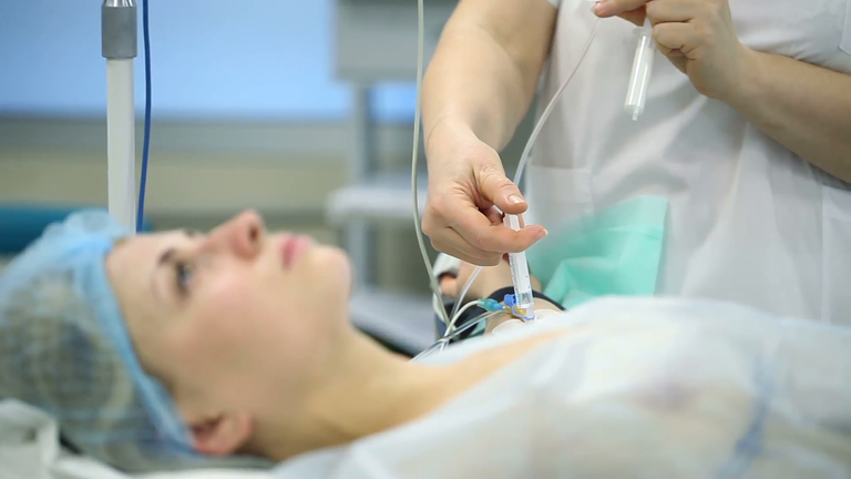 the-girl-on-the-operating-table-the-patient-is-administered-a-dose-of-anesthesia-syringe_4qfbzdyhe__F0000.png