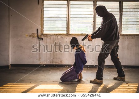 stock-photo-a-terrorist-man-holding-gun-kidnapping-young-women-for-a-hostage-in-abandoned-building-rape-655429441.jpg